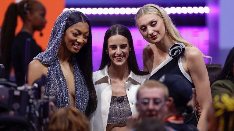 From left, LSU's Angel Reese, Iowa's Caitlyn Clark, and Stanford's Cameron Brink, pose for a photo before the start of the WNBA basketball draft, Monday, April 15, 2024, in New York. (Adam Hunger/AP)