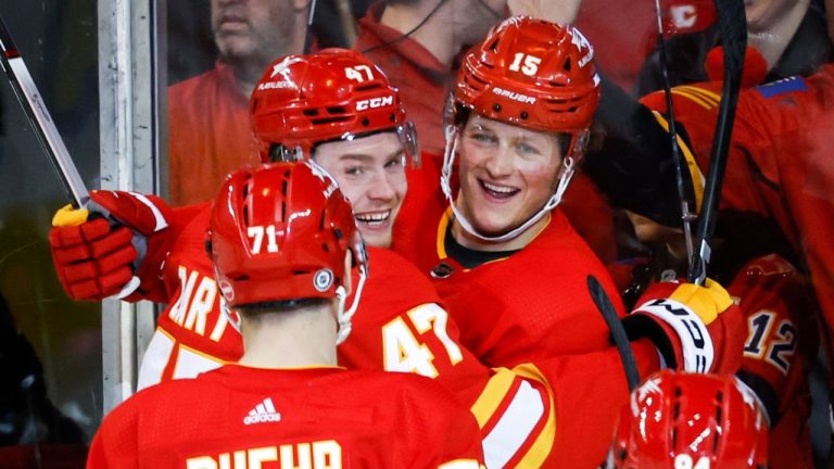 Calgary Flames forward Connor Zary celebrates his goal with teammates forward Dryden Hunt and forward Walker Duehr during second period NHL hockey action against the Arizona Coyotes in Calgary, Alta., Sunday, April 14, 2024. (Jeff McIntosh/CP Photo)