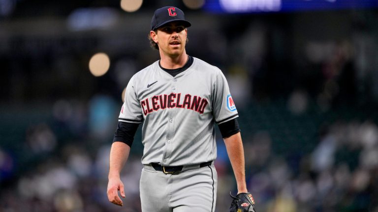 Cleveland Guardians starting pitcher Shane Bieber walks back to the dugout after facing the Seattle Mariners during the first inning of a baseball game Tuesday, April 2, 2024, in Seattle. (Lindsey Wasson/AP)