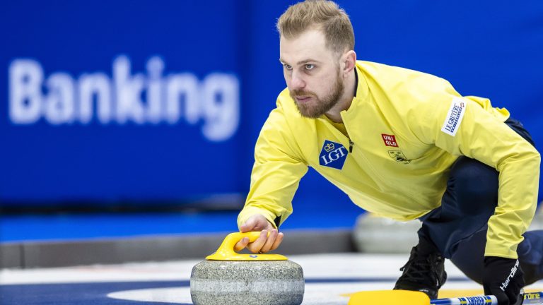 Sweden's Rasmus Wranå delivers a stone in this file photo from the World men's Curling Championship, at the IWC Arena in Schaffhausen, Switzerland on Sunday March 31, 2024.  (Michael Buholzer/AP)