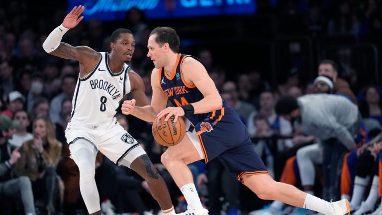 New York Knicks forward Bojan Bogdanovic (44) drives against Brooklyn Nets guard Lonnie Walker IV (8) during the first half of an NBA basketball game Friday, April 12, 2024, at Madison Square Garden in New York. (Mary Altaffer/AP)