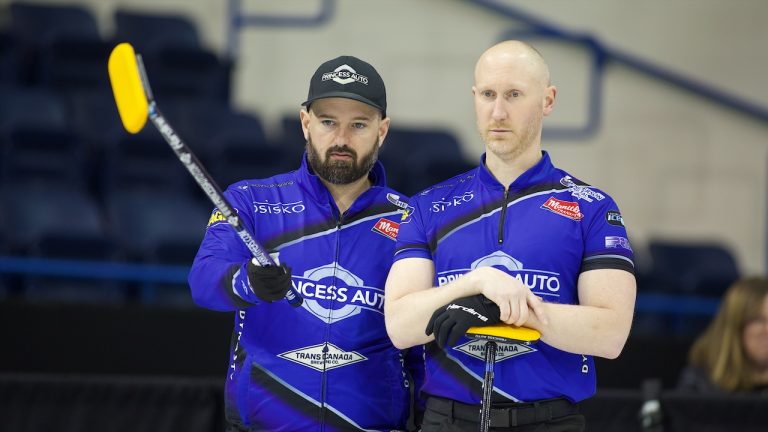 Reid Carruthers (left) and Brad Jacobs (right) discuss strategy during the 2024 Princess Auto Players' Championship in Toronto. (Anil Mungal/GSOC)