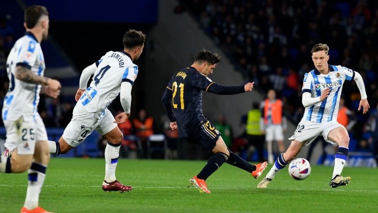 Real Madrid's Brahim Diaz shoots the ball besides Real Sociedad's Takefusa Kubo, left, and Real Sociedad's Benat Turrientes during the Spanish La Liga soccer match between Real Sociedad and Real Madrid in San Sebastian, Spain, Friday, April 26, 2024. (Alvaro Barrientos/AP)