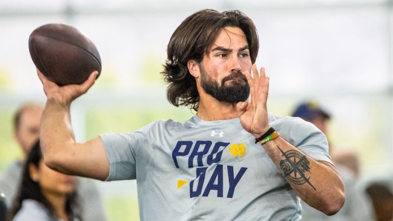 FILE - Notre Dame quarterback Sam Hartman runs a drill during NFL pro day football workouts in South Bend, Ind., Thursday, March 21, 2024. The Washington Commanders have signed former Notre Dame and Wake Forest quarterback Sam Hartman among 11 undrafted free agents. (Michael Caterina/AP)