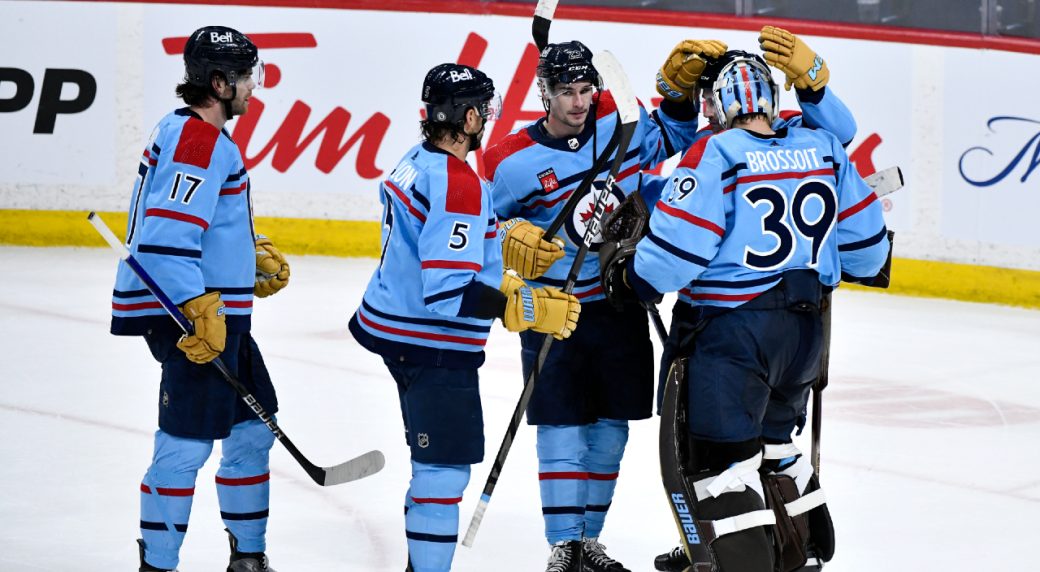 Jets clinch playoff berth with win over Flames
