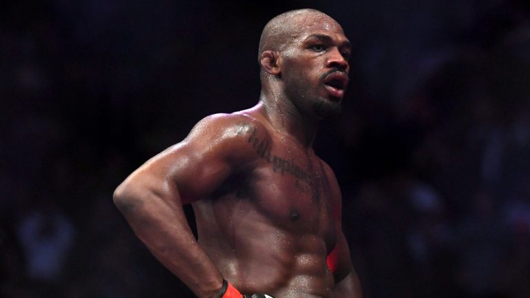 Jon Jones goes up on top of the octagon after defeating Alexander Gustafsson in the UFC men's light heavyweight mixed martial arts bout at UFC 232, Saturday, Dec. 29, 2018, in Inglewood, Calif. (Kyusung Gong/AP)