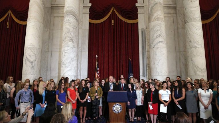 FILE - Sen. Jerry Moran, R-Kansas, centre left, and Sen. Richard Blumenthal, D-Conn., attend a news conference with dozens of women and girls who were sexually abused by Larry Nassar, a former doctor for Michigan State University athletics and USA Gymnastics, July 24, 2018, on Capitol Hill in Washington. (Jacquelyn Martin/AP)