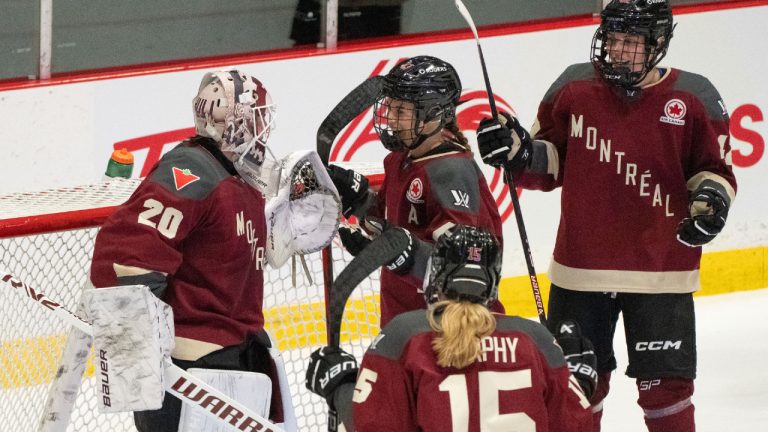 Montreal's Kristin O'Neill (43), Maureen Murphy (15) and Claire Dalton (42) congratulate goaltender Elaine Chuli (20) on their win over Minnesota following third period PWHL hockey action in Montreal on Thursday, April 18, 2024. (Christinne Muschi/CP)