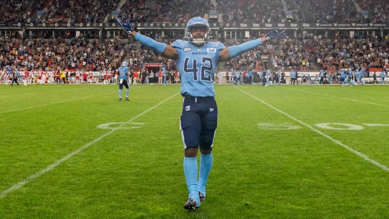 Toronto Argonauts defensive back Qwan'tez Stiggers (42) celebrates teammate Javon Leake's (not seen) touchdown against the Calgary Stampeders during second half CFL football action. (Spencer Colby/THE CANADIAN PRESS)