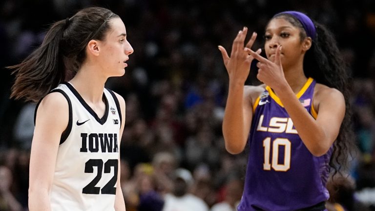 LSU's Angel Reese reacts in front of Iowa's Caitlin Clark during the second half of the NCAA Women's Final Four championship basketball game Sunday, April 2, 2023, in Dallas. LSU won 102-85 to win the championship. (Tony Gutierrez/AP)