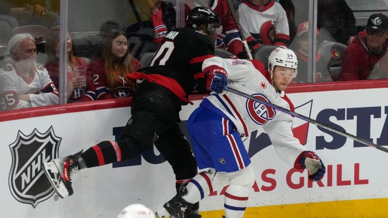 Montreal Canadiens defenceman Jordan Harris (54) and Ottawa Senators left wing Bokondji Imama collide along the boards during first period NHL action in Ottawa, Saturday, April 13, 2024. (Adrian Wyld/THE CANADIAN PRESS)