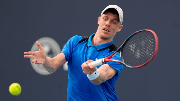 Denis Shapovalov, of Canada, hits a return to Stefanos Tsitsipas, of Greece, during the Miami Open tennis tournament Saturday, March 23, 2024, in Miami Gardens, Fla. (Lynne Sladky/AP)