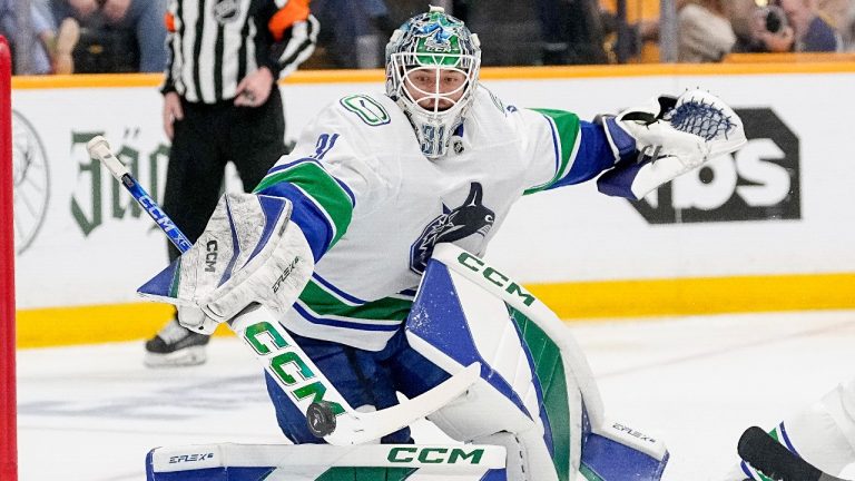 Vancouver Canucks goaltender Arturs Silovs (31) blocks a shot on goal against the Nashville Predators during the second period in Game 4 of an NHL hockey Stanley Cup first-round playoff series Sunday, April 28, 2024, in Nashville, Tenn. (George Walker IV/AP)