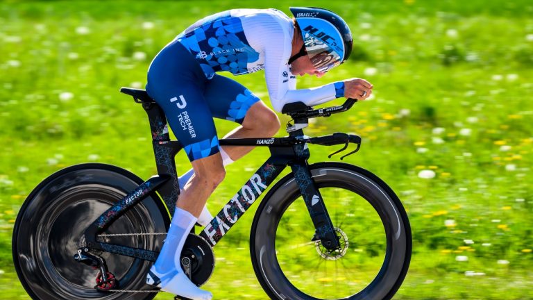 Michael Woods from Canada competes in the prologue, a 5,12 km race against the clock at the 75th Tour de Romandie UCI ProTour cycling race in Lausanne, Switzerland, Tuesday, April 26, 2022. (Jean-Christophe Bott/Keystone via AP)