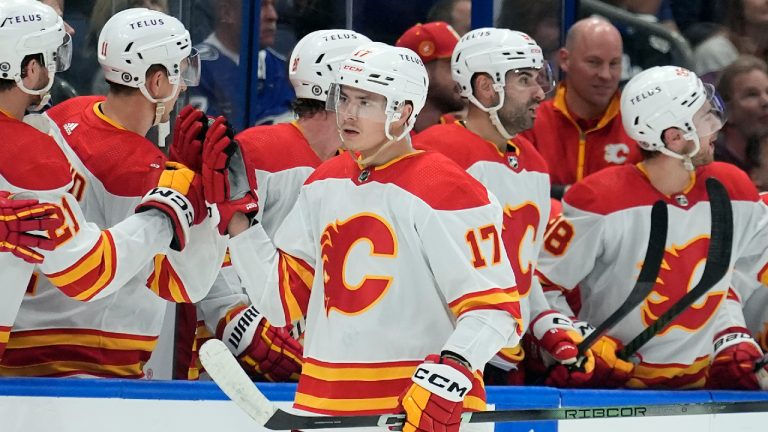 Calgary Flames centre Yegor Sharangovich (17) celebrates with the bench after scoring against the Tampa Bay Lightning during the second period of an NHL hockey game Thursday, March 7, 2024, in Tampa, Fla. (Chris O'Meara/AP)