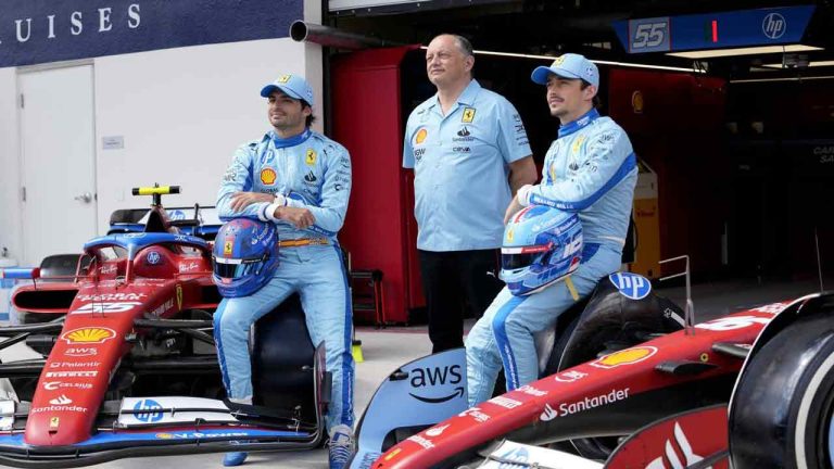 Ferrari driver Carlos Sainz, of Spain, left, Ferrari team principal Fred Vasseur, center, and Ferrari driver Charles Leclerc, of Monaco, pose for a photograph in recognition of Ferrari's partnership with HP, ahead of the Miami Formula One Grand Prix, Thursday, May 2, 2024, in Miami Gardens, Fla. (Lynne Sladky/AP)