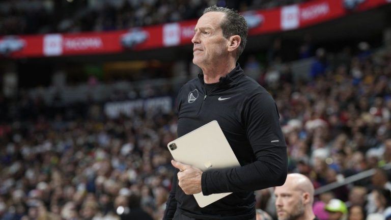 Golden State Warriors assistant coach Kenny Atkinson watches during the first half of the team's NBA basketball game against the Denver Nuggets on Dec. 25, 2023, in Denver. (David Zalubowski/AP Photo)
