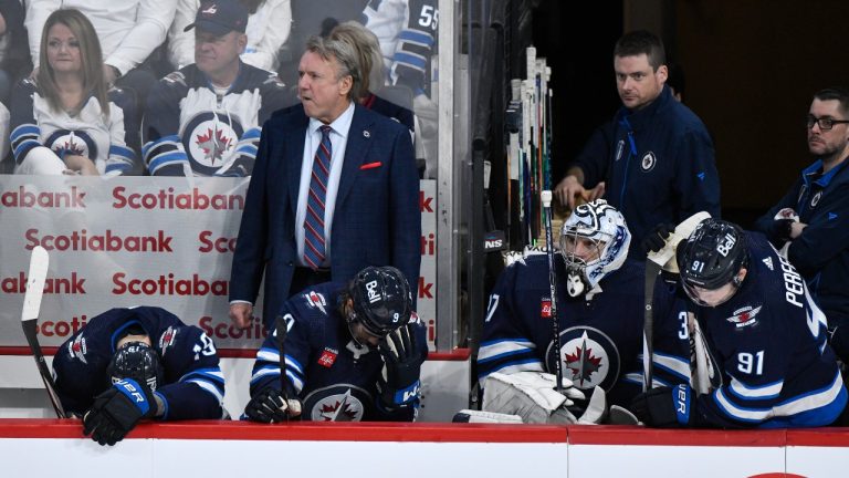 Winnipeg Jets' head coach Rick Bowness and players watch the end of Game 5 of their NHL hockey Stanley Cup first-round playoff series against the Colorado Avalanche in Winnipeg, Tuesday April 30, 2024. (Fred Greenslade/CP)