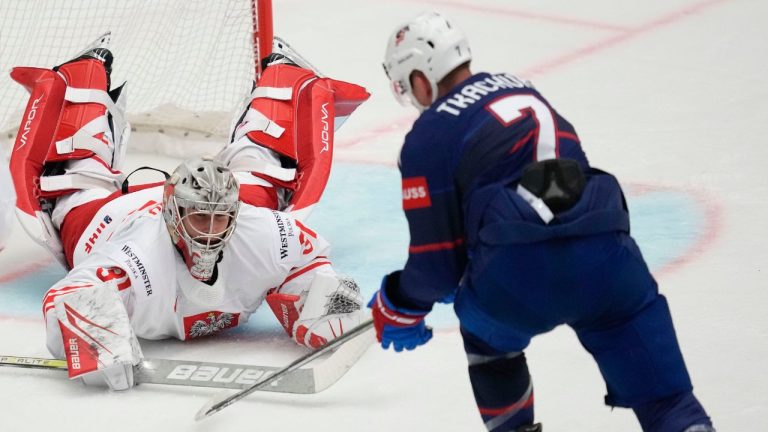 Poland's goalkeeper John Murray makes a save in front of Unted States' Brady Tkachuk during the preliminary round match between Poland and United States at the Ice Hockey World Championships in Ostrava, Czech Republic, Friday, May 17, 2024. (Darko Vojinovic/AP Photo)