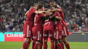 Brest's Romain Del Castillo is congratulated after scoring his side's 3rd goal during a French League One soccer match between Lyon and Brest at the Groupama stadium, outside Lyon, France, Sunday, April 14, 2024. (Laurent Cipriani/AP Photo)