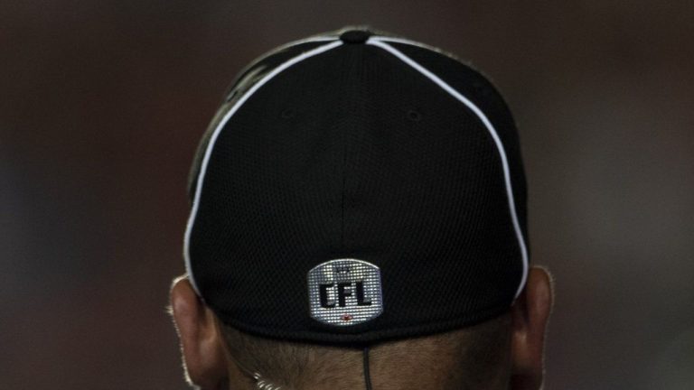 The CFL will implement adjustments to its rules on low block and command centre intervention in 2024. A CFL official is seen during a game in Ottawa Friday July 5, 2019. (CP/Adrian Wyld)