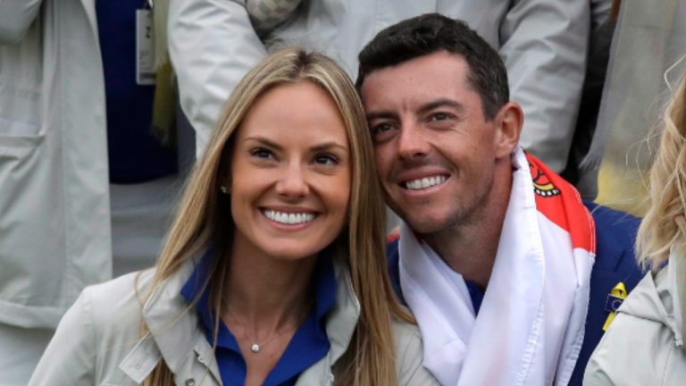 Europe's Rory McIlroy and his then partner Erica Stoll, left, celebrate after Europe won the Ryder Cup on the final day of the 42nd Ryder Cup at Le Golf National in Saint-Quentin-en-Yvelines, outside Paris, France, Sunday, Sept. 30, 2018. (Matt Dunham/AP) 