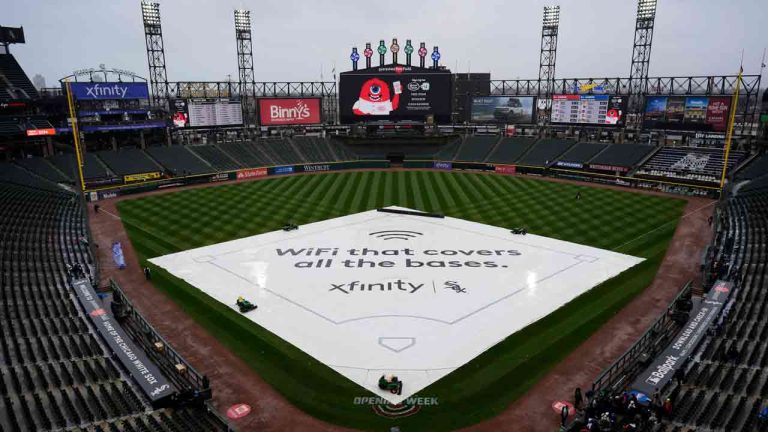 The tarp covers the infield before a baseball game between the Chicago White Sox and the Atlanta Braves in Chicago, Wednesday, April 3, 2024. (Nam Y. Huh/AP)