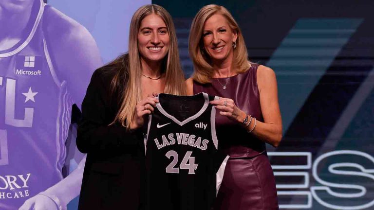 Iowa's Kate Martin, left, poses for a photo with WNBA commissioner Cathy Engelbert, right, after being selected 18th overall by the Las Vegas Aces during the second round of the WNBA basketball draft on Monday, April 15, 2024, in New York. (Adam Hunger/AP)