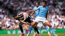 Man City stays in control of Premier League title race with win at Fulham