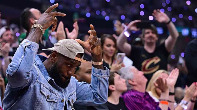 Los Angeles Lakers forward LeBron James, left, acknowledges the crowd during the first half of Game 4 of an NBA basketball second-round playoff series between the Cleveland Cavaliers and the Boston Celtics, Monday, May 13, 2024, in Cleveland. (David Dermer/AP)