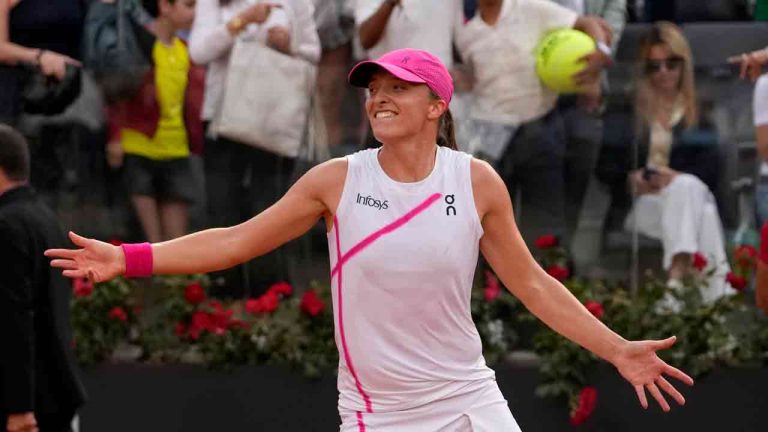 Iga Swiatek, of Poland, celebrates after defeating Aryna Sabalenka, of Belarus, in the Italian Open tennis tournament final match at Rome's Foro Italico, Saturday, May 18, 2024. Swiatek won 6-2/6-3. (Alessandra Tarantino/AP)