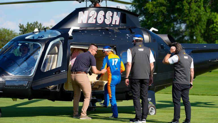 Kyle Larson boards a helicopter after qualifying for the Indianapolis 500 auto race at Indianapolis Motor Speedway in Indianapolis, Sunday, May 19, 2024. (Michael Conroy/AP) 