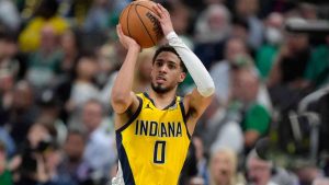 Indiana Pacers guard Tyrese Haliburton (0) shoots over Boston Celtics guard Derrick White (9) during the second half of Game 2 of the NBA Eastern Conference basketball finals Thursday, May 23, 2024, in Boston. (Steven Senne/AP)