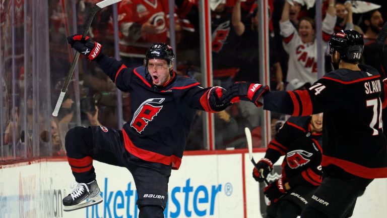 Carolina Hurricanes' Evgeny Kuznetsov celebrates with Jaccob Slavin nearby after scoring during the first period in Game 4 of an NHL hockey Stanley Cup second-round playoff series against the New York Rangers in Raleigh, N.C., Saturday, May 11, 2024. (Karl B DeBlaker/AP Photo)