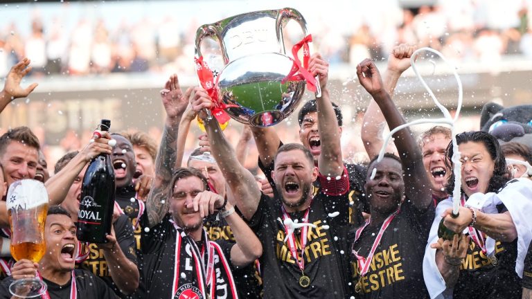 FC Midtjylland's players celebrate winning the Danish Superliga trophy at MCH Arena in Herning, Denmark, on Sunday, May 26, 2024. (Bo Amstrup/Ritzau Scanpix via AP)