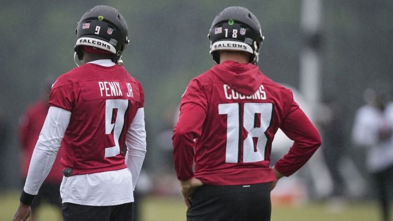 Atlanta Falcons quarterbacks Kirk Cousins and Michael Penix Jr., run drills during an NFL football mini training camp practice on Tuesday, May 14, 2024, in Flowery Branch, Ga. (Brynn Anderson/AP Photo)
