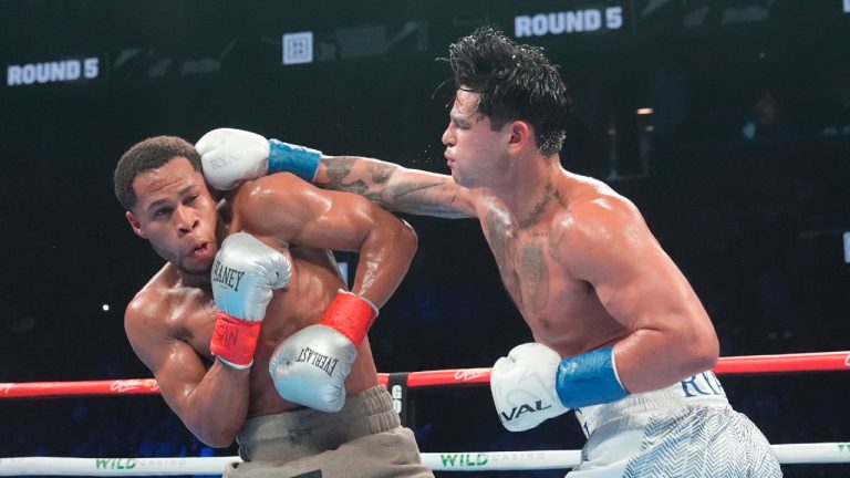 Ryan Garcia, right, punches Devin Haney of a super lightweight boxing match Sunday, April 21, 2024, in New York. Garcia won the fight. (Frank Franklin II/AP)