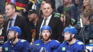 Head coach Rick Tocchet of the Vancouver Canucks looks on from the bench in Game 5 of the second round of the 2024 Stanley Cup Playoffs against the Edmonton Oilers at Rogers Arena on May 16, 2024, in Vancouver. (Getty Images)