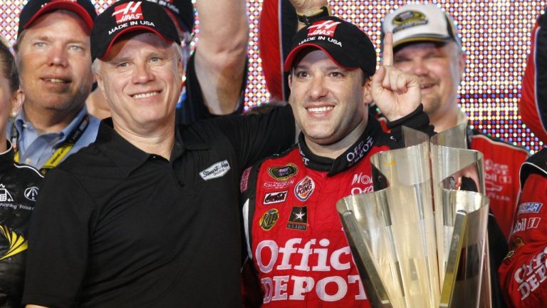 Team co-owner Carl Haas and Tony Stewart, right, pose with the NASCAR Sprint Cup Series season-championship trophy at Homestead-Miami Speedway in Homestead, Fla., Sunday, Nov. 20, 2011. (Terry Renna/AP Photo)
