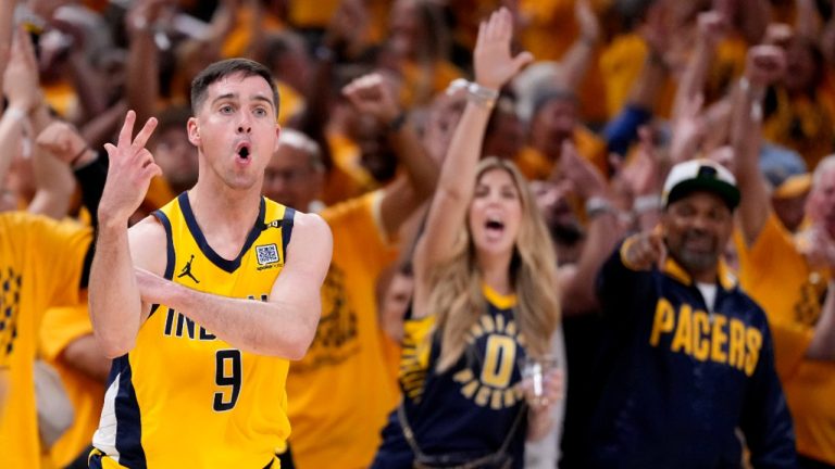 Indiana Pacers guard T.J. McConnell (9) celebrates after making a three-point basket during the second half of Game 3 of the NBA Eastern Conference basketball finals against the Boston Celtics, Saturday, May 25, 2024, in Indianapolis. (AP Photo/Michael Conroy)