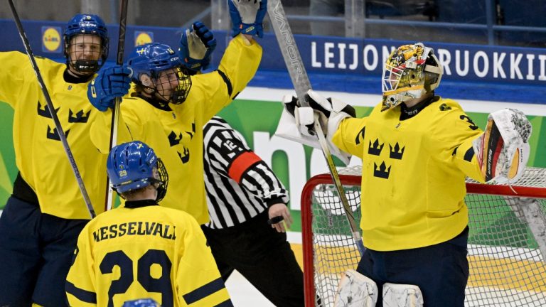 Swedish players including goalkeeper Love Härenstam celebrate their 4-0 victory after the 2024 IIHF ice hockey U18 world championships bronze medal match between Sweden and Slovakia in Espoo, Finland, on May 5, 2024. (LEHTIKUVA / JUSSI NUKARI)