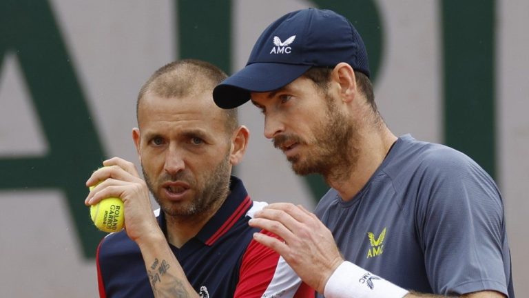 Britain's Andy Murray, right, and Britain's Daniel Evans, left, talk strategy during their men's doubles match of the French Open tennis tournament against Brazil's Thiago Seyboth Wild and Argentina's Sebastian Baez at the Roland Garros stadium in Paris, Friday, May 31, 2024. (AP/Jean-Francois Badias)