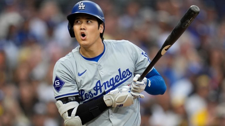 Los Angeles Dodgers' Shohei Ohtani reacts to an inside pitch during the sixth inning of a baseball game against the San Diego Padres, Saturday, May 11, 2024, in San Diego. (Gregory Bull/AP)