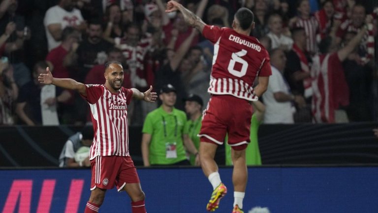 Olympiacos' Ayoub El Kaabi, left, and Olympiacos' Chiquinho celebrate at the end of the Conference League final soccer match between Olympiacos FC and ACF Fiorentina at OPAP Arena in Athens, Greece, Thursday, May 30, 2024. Olympiacos won 1-0. (Thanassis Stavrakis/AP)