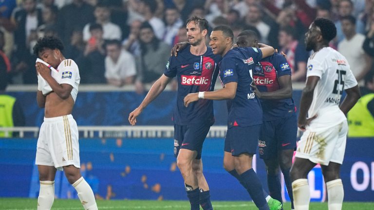 PSG's Kylian Mbappe, centre, celebrates with teammates after the French Cup final soccer match between Lyon and PSG at the Pierre Mauroy stadium in Villeneuve d'Ascq, northern France, Saturday, May 25, 2024. PSG won the match 2-1. (Michel Euler/AP)