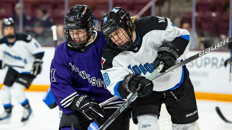 Minnesota’s Denisa Krisova and Toronto’s Jesse Compher battle for position in a game on Feb. 27. (Photo by Kelly Hagenson/PWHL)