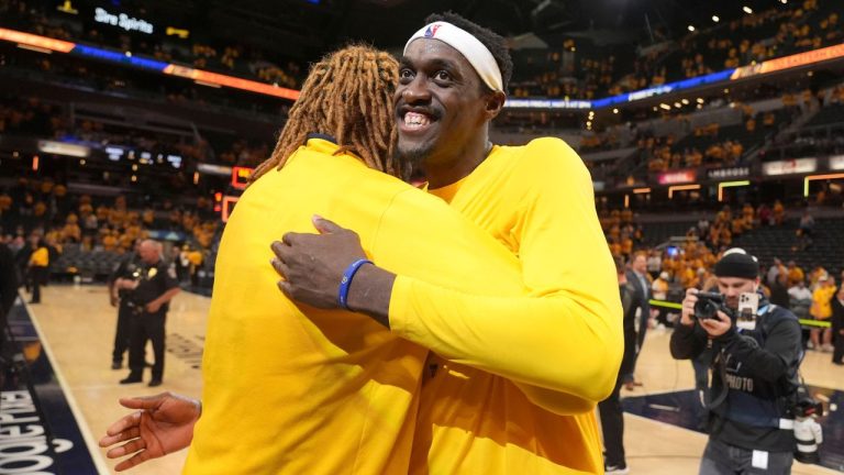 Indiana Pacers forward Pascal Siakam gets a hug from teammate James Johnson after Game 6 against the Milwaukee Bucks in an NBA basketball first-round playoff series, Thursday, May 2, 2024, in Indianapolis. (Michael Conroy/AP Photo)