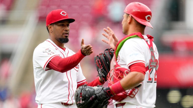 Cincinnati Reds' Alexis Díaz, left, celebrates with teammate Luke Maile after the Reds defeated the Los Angeles Dodgers. (Jeff Dean/AP)