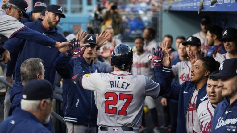 Atlanta Braves' Austin Riley returns to the dugout after hitting a home run during the first inning of a baseball game against the Los Angeles Dodgers in Los Angeles, Friday, May 3, 2024. (Ashley Landis/AP Photo)
