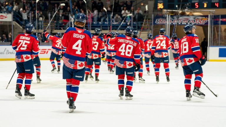 Saginaw Spirit' players put their hockey sticks in the air after winning the opening hockey game of the Memorial Cup against the Moose Jaw Warriors in Saginaw, Mich., Friday, May 24, 2024. (Julian Leshay Guadalupe/The Flint Journal via AP)